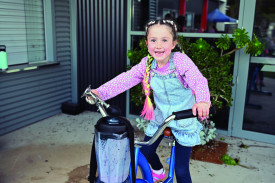 Olive McGurk on the exercise bike, riding to make herself a smoothie.