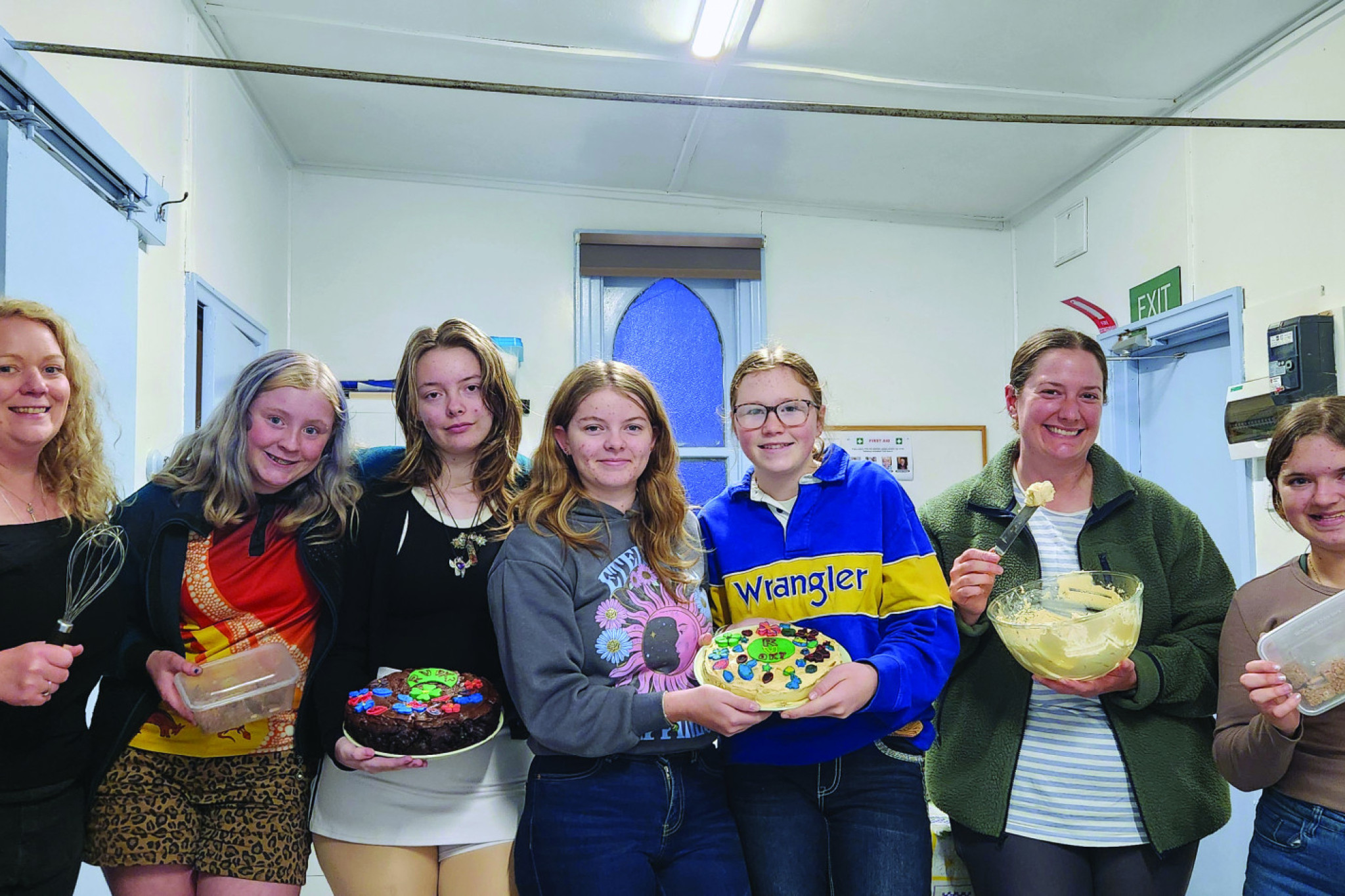 Vision St Arnaud Youth Group members showing off their baked goods.