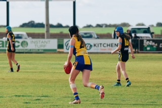 Abby pictured (centre) on the field during the season.