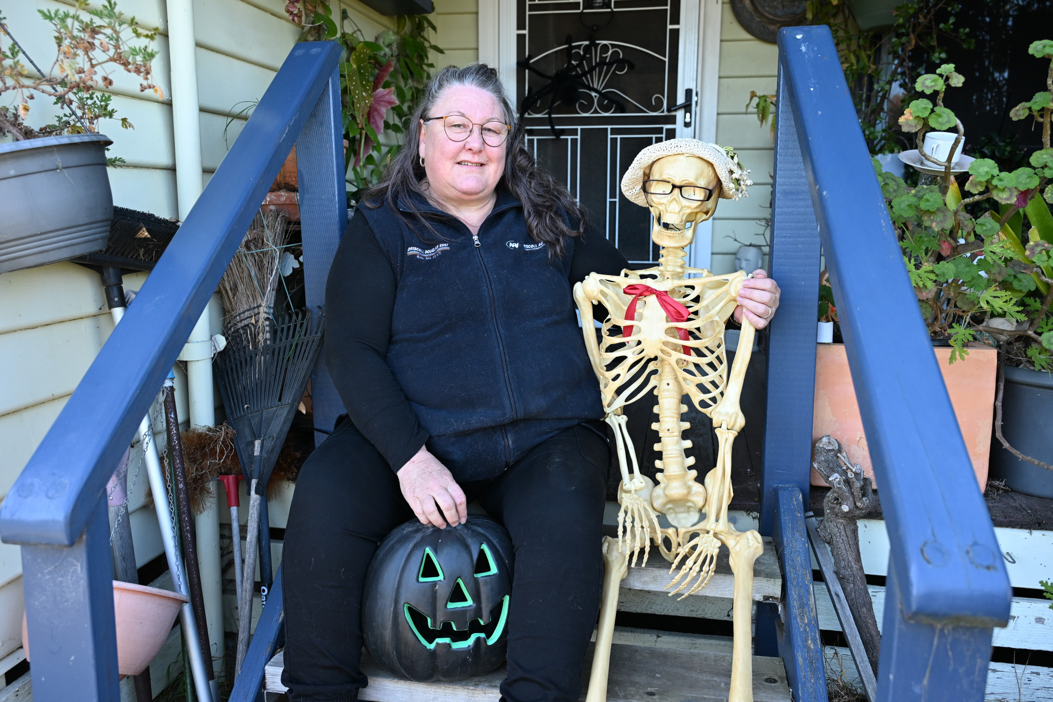 Megan Cummings and her skeleton judge Marjorie ready for Halloween on Friday.NCN PHOTO