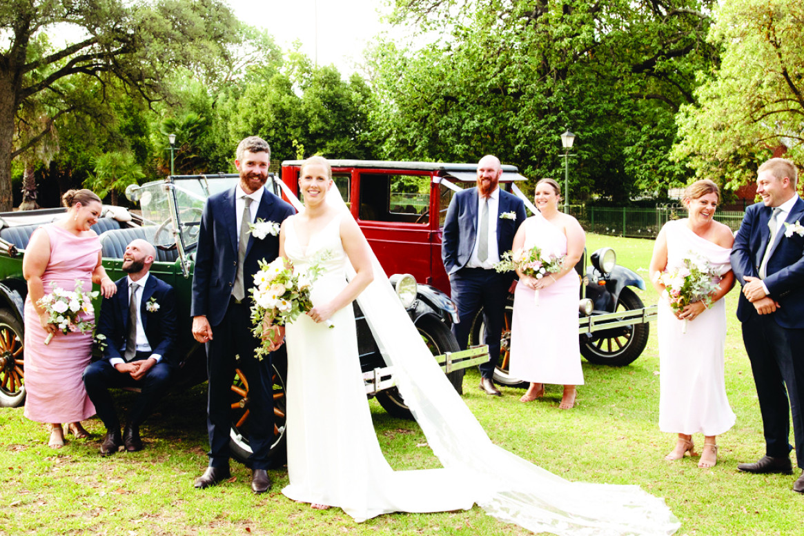 Bride and Groom Stacey and Brad with their attendants and their vintage cars.
