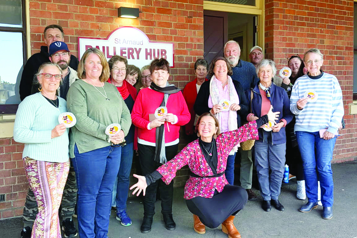 Catherine Deveny (centre) hams it up for the camera with the ‘inspired’ locals.