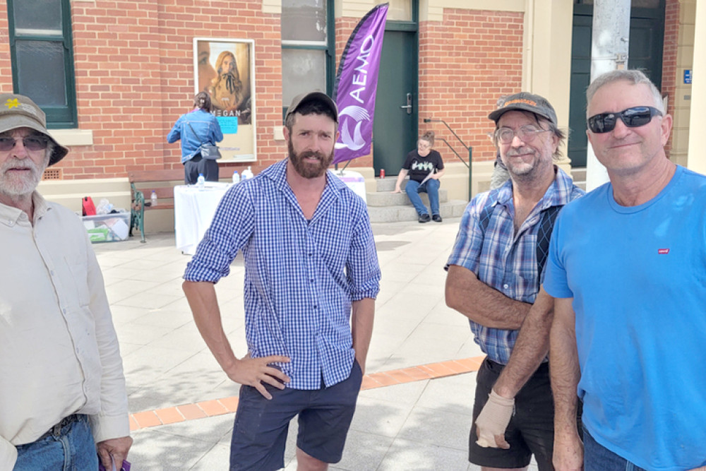 Farmers chatting about the impending Information Night after picking up detailed brochures (left to right) Trevor McDonald, his son Brad McDonald, Jack Lehmann and Gerald Feeny.