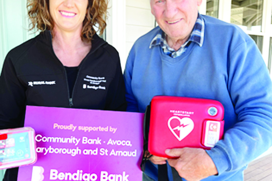 Naomi Medlyn (left) Bendigo Bank was able to assist Stuart Mill in the purchase of a second defibrillator as pictured with Rodney Medlyn