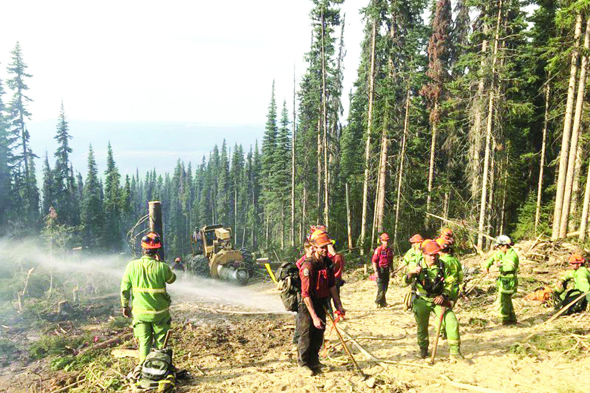 The difficult terrain that the fire fighters had to work through putting in containment lines with a forest area.